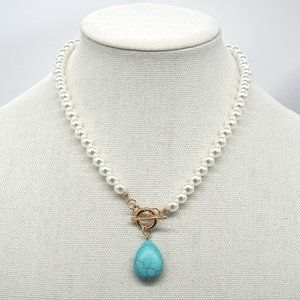 Turquoise stone with pearl chain. Toggle clasp.